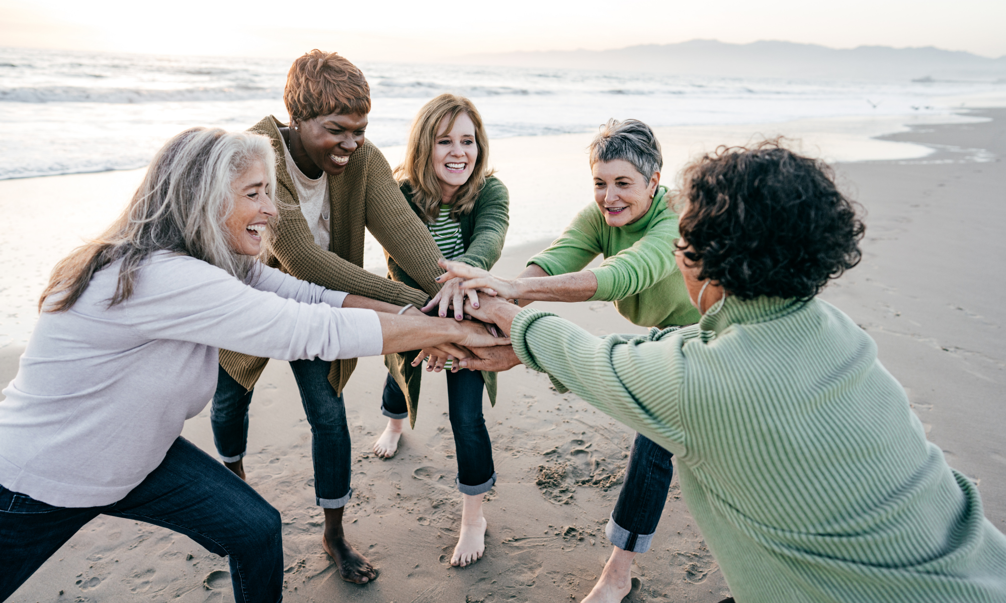 Support group enjoying the day together on the beach Support group enjoying the day together on the beach