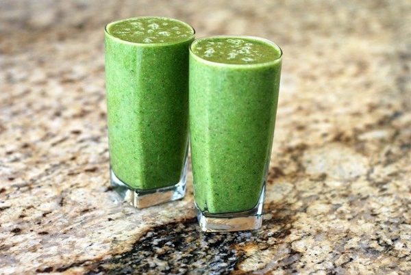 Two healthy-looking green smoothies